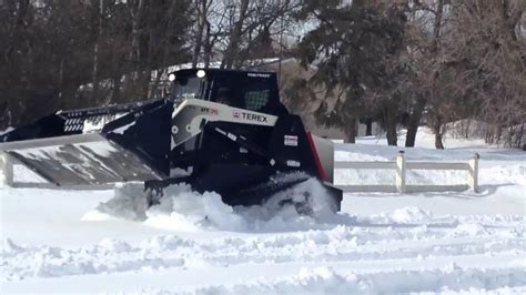 skid steer tracks in deep snow